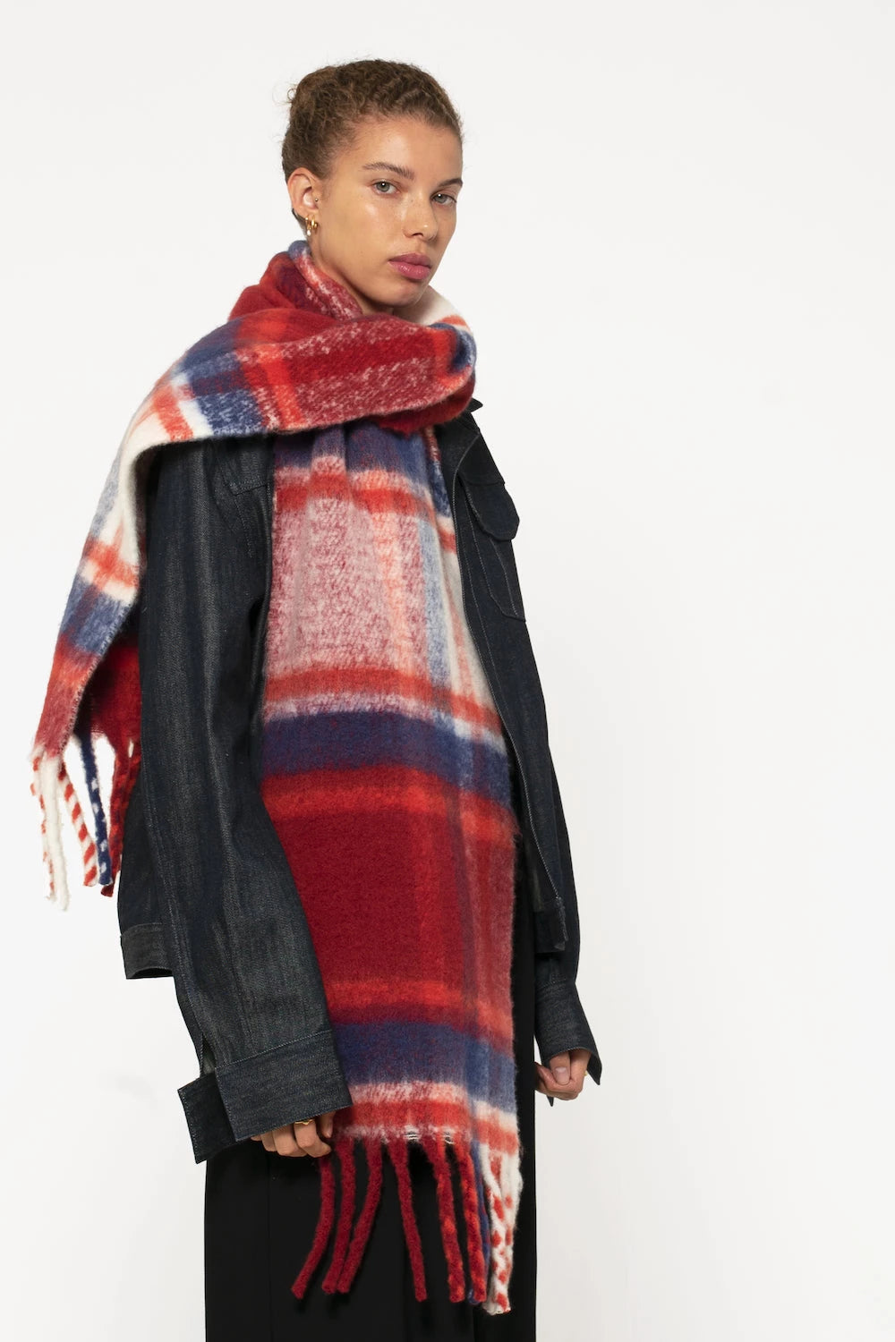 woman wearing oversized red & navy plaid scarf with soft fluffy material